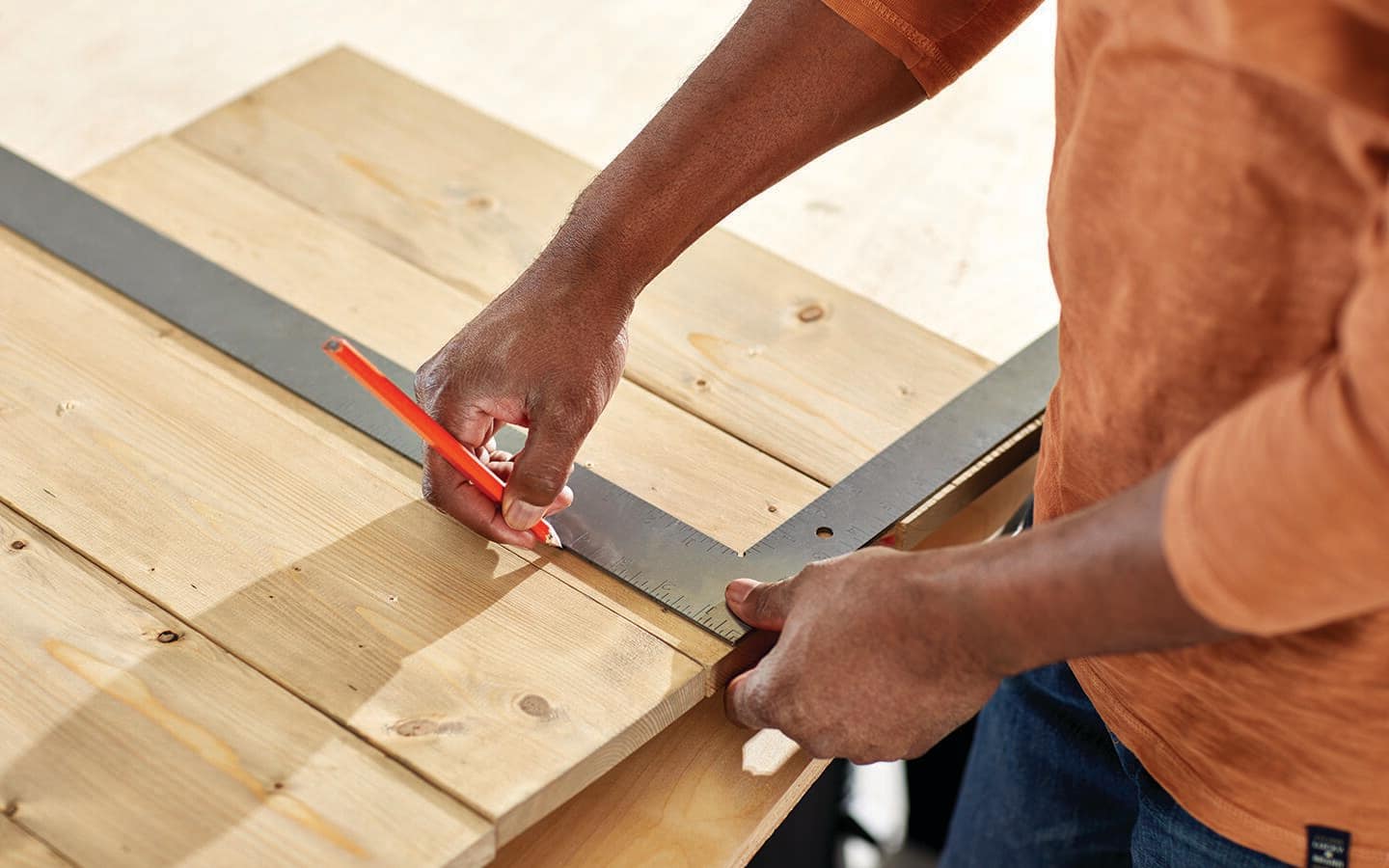 Someone measuring nail holes for an Advent calendar.