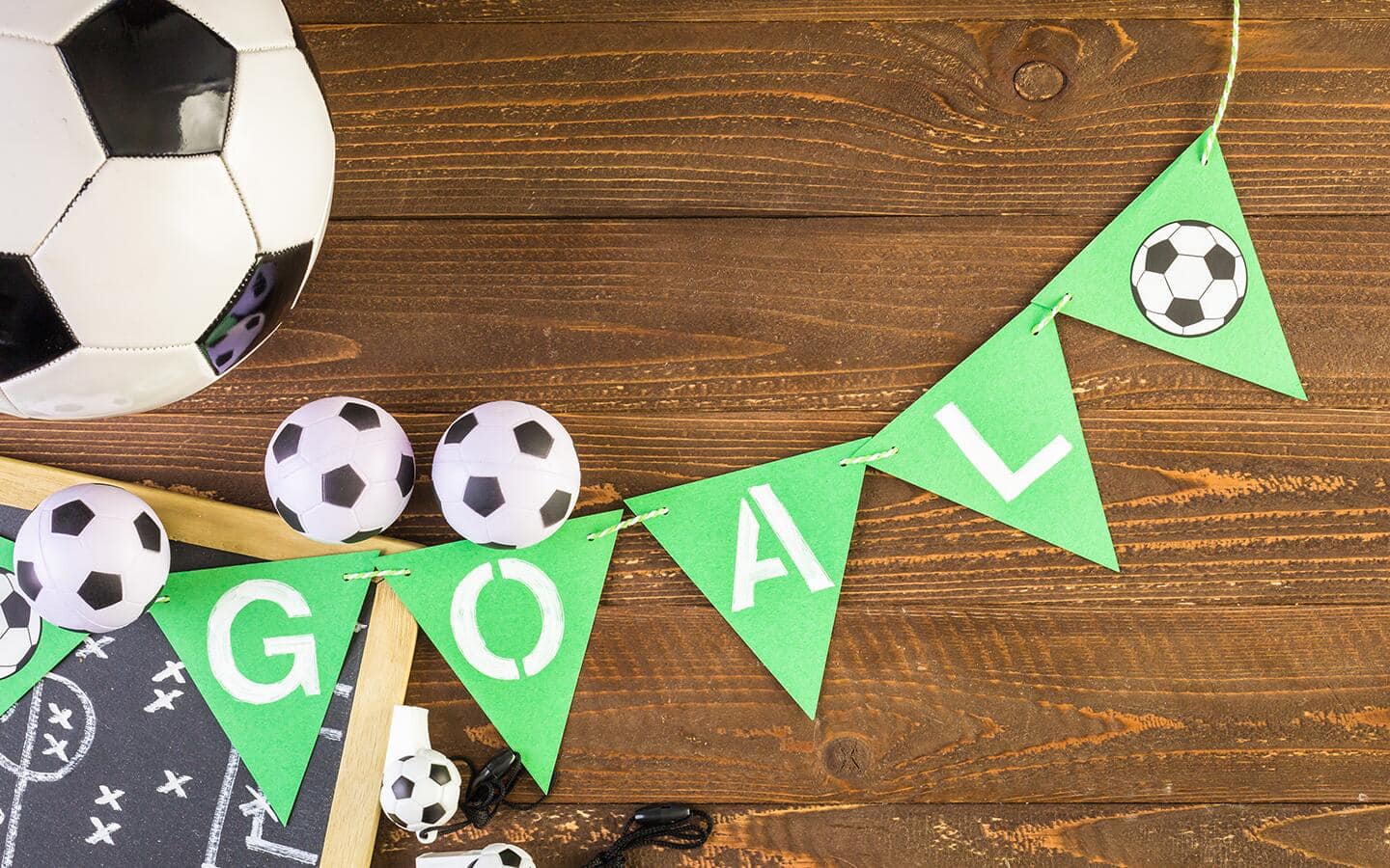 A DIY soccer pennant made with green triangles and white letters. A DIY soccer pennant made with green triangles and white letters.