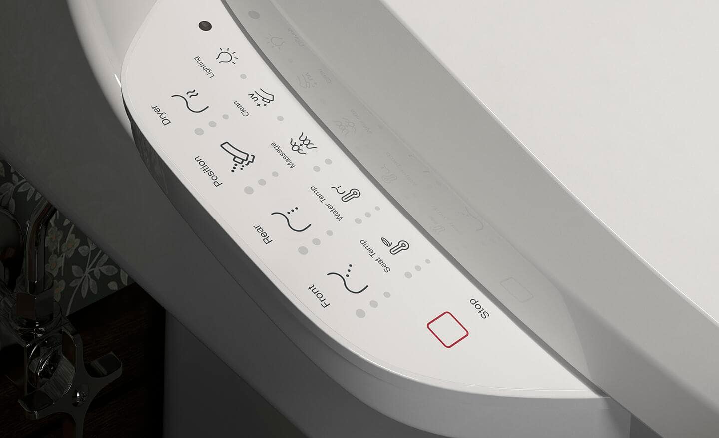 A control panel on a bidet that controls the water pressure and temperature.