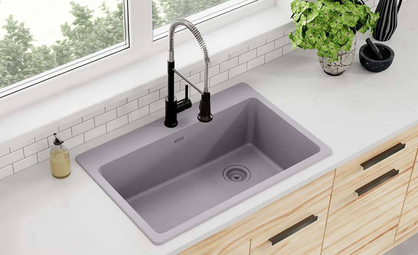 A granite/quartz composite drop-in sink.