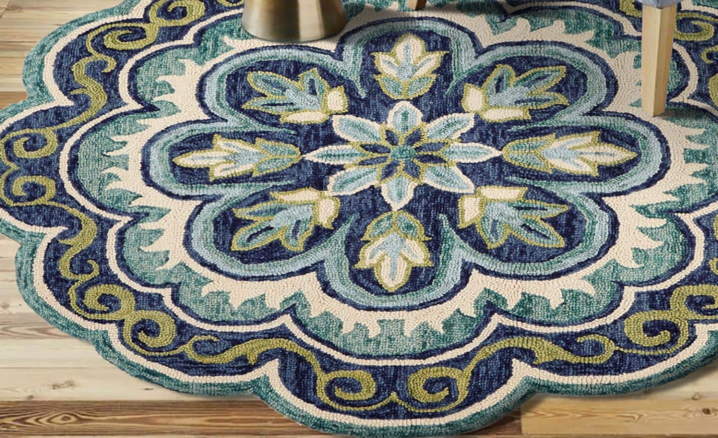 An octagon-shaped blue and green rug with a traditional pattern.