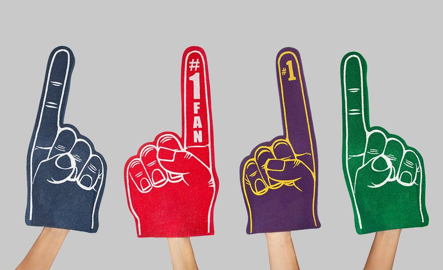 Hands holding foam sports fingers in different team colors.