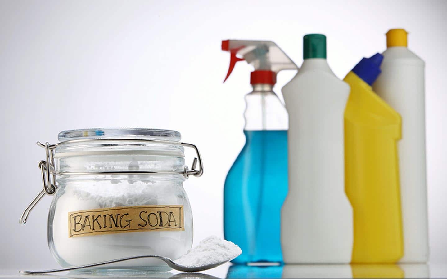 Baking soda and other cleaning supplies sitting on a counter. Baking soda and other cleaning supplies sitting on a counter.