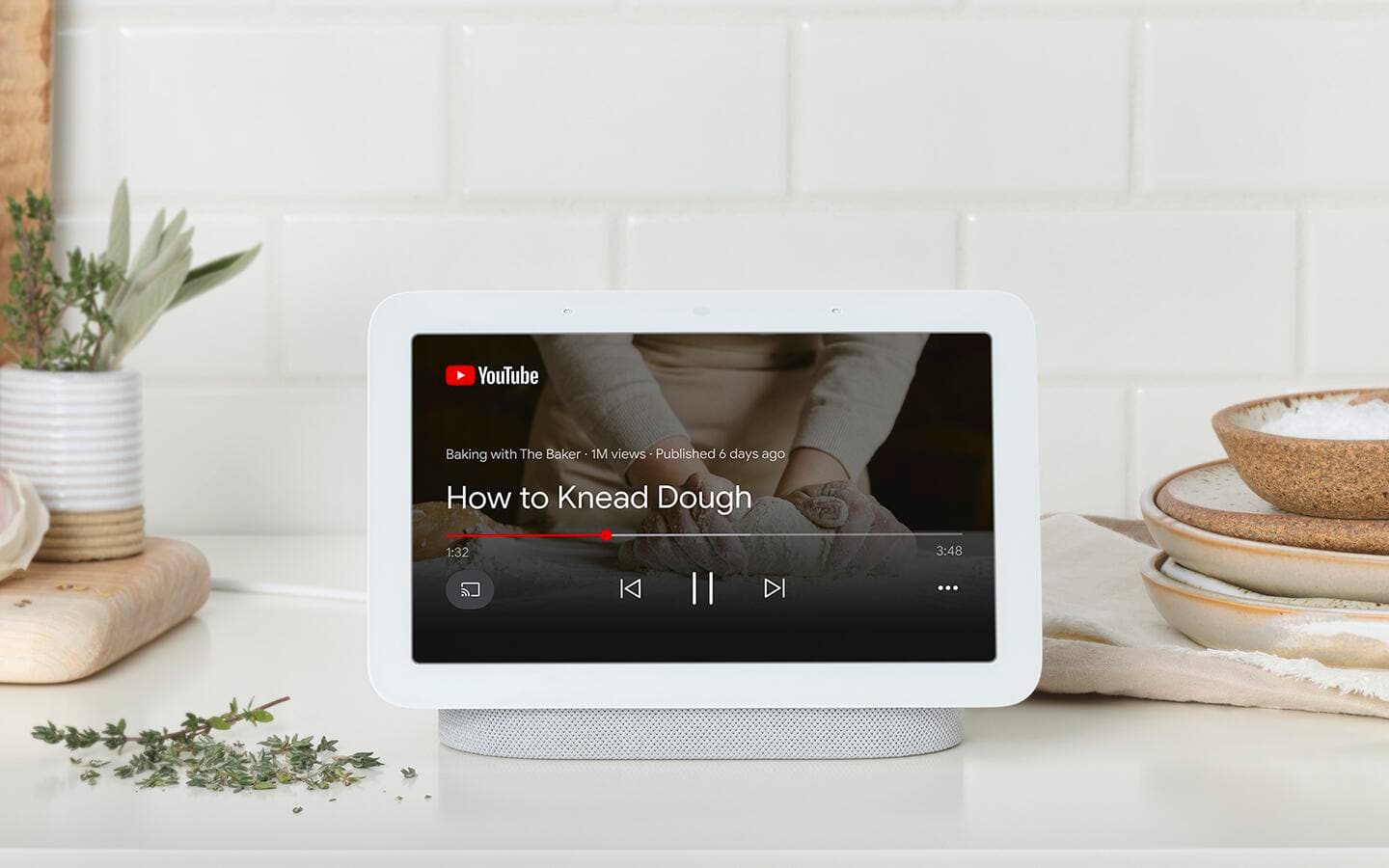 A smart hub on a kitchen counter showing a recipe. A smart hub on a kitchen counter showing a recipe.