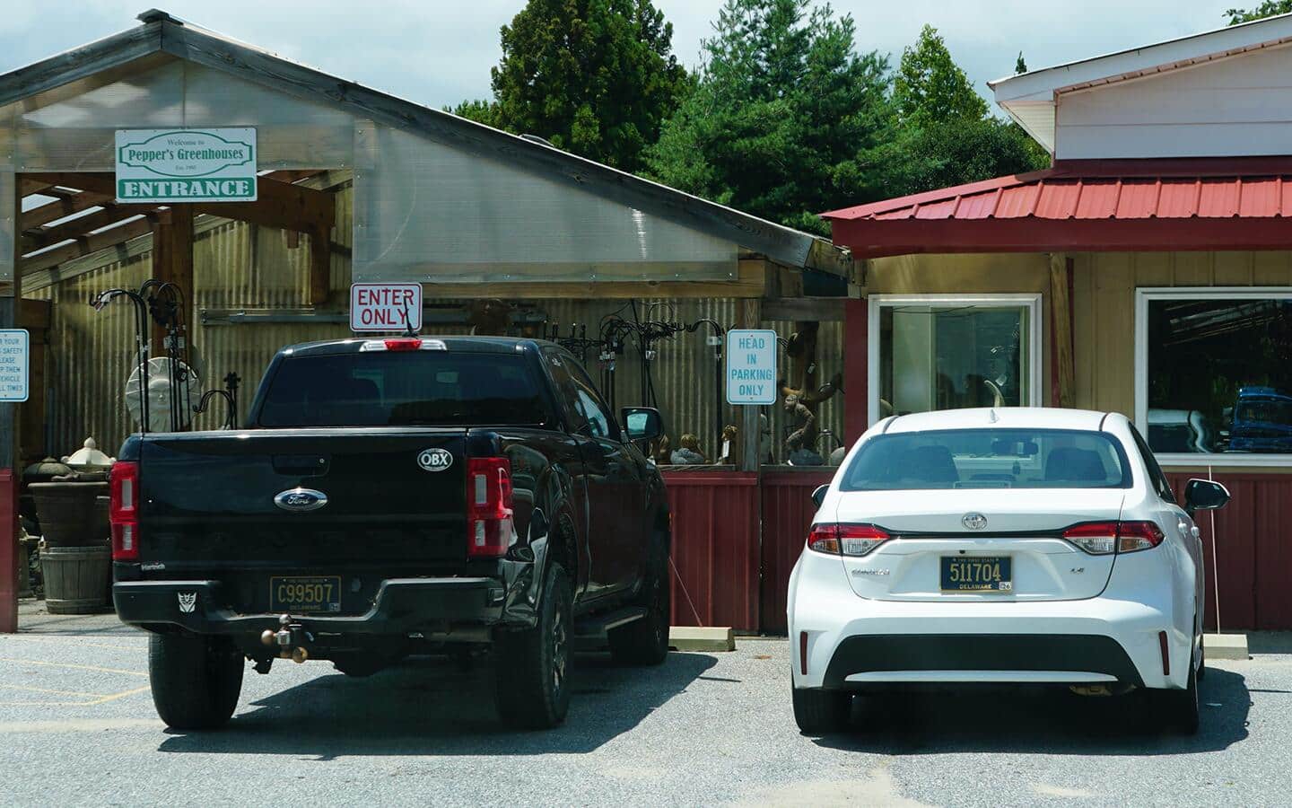 A car and a truck parked in a parking lot. A car and a truck parked in a parking lot.