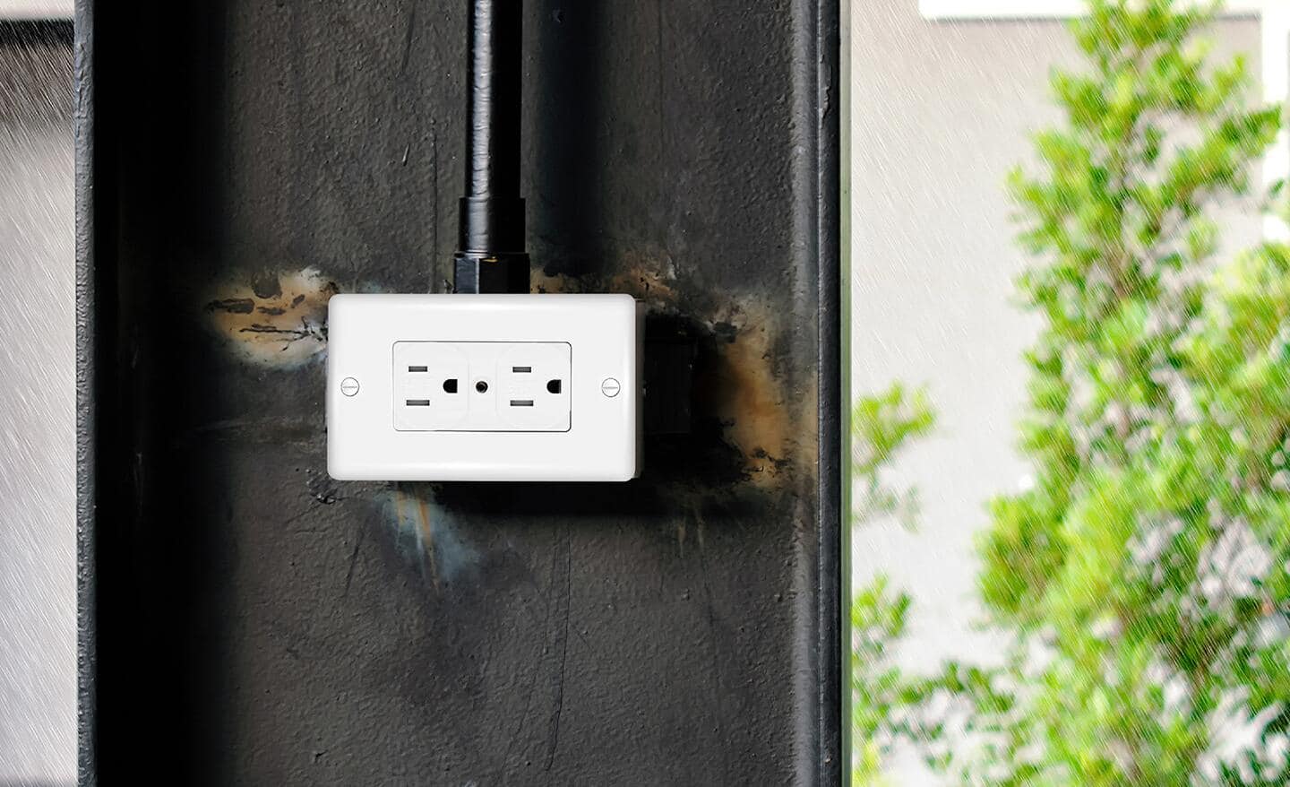 A weather-resistant receptacle placed on an outside wall.