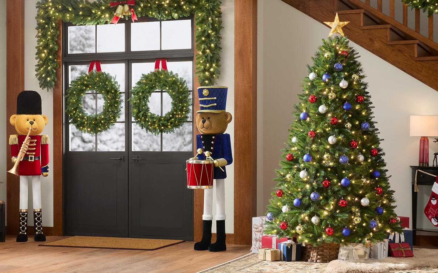 An artificial long needle pine near the front door in a Christmas-decorated living room. 
