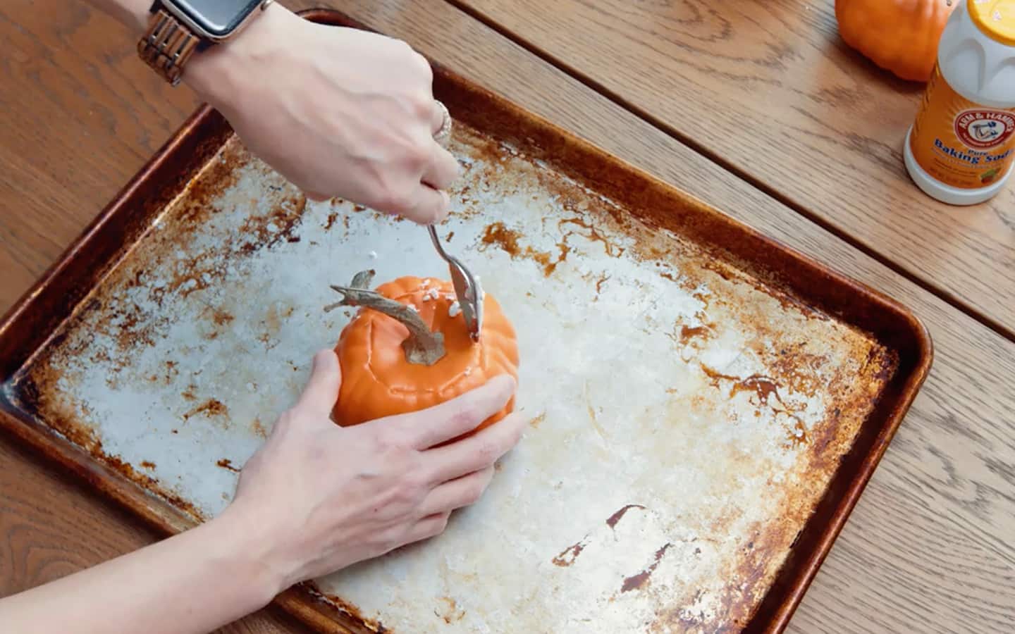 A small pumpkin is hollowed with a spoon. A small pumpkin is hollowed with a spoon.