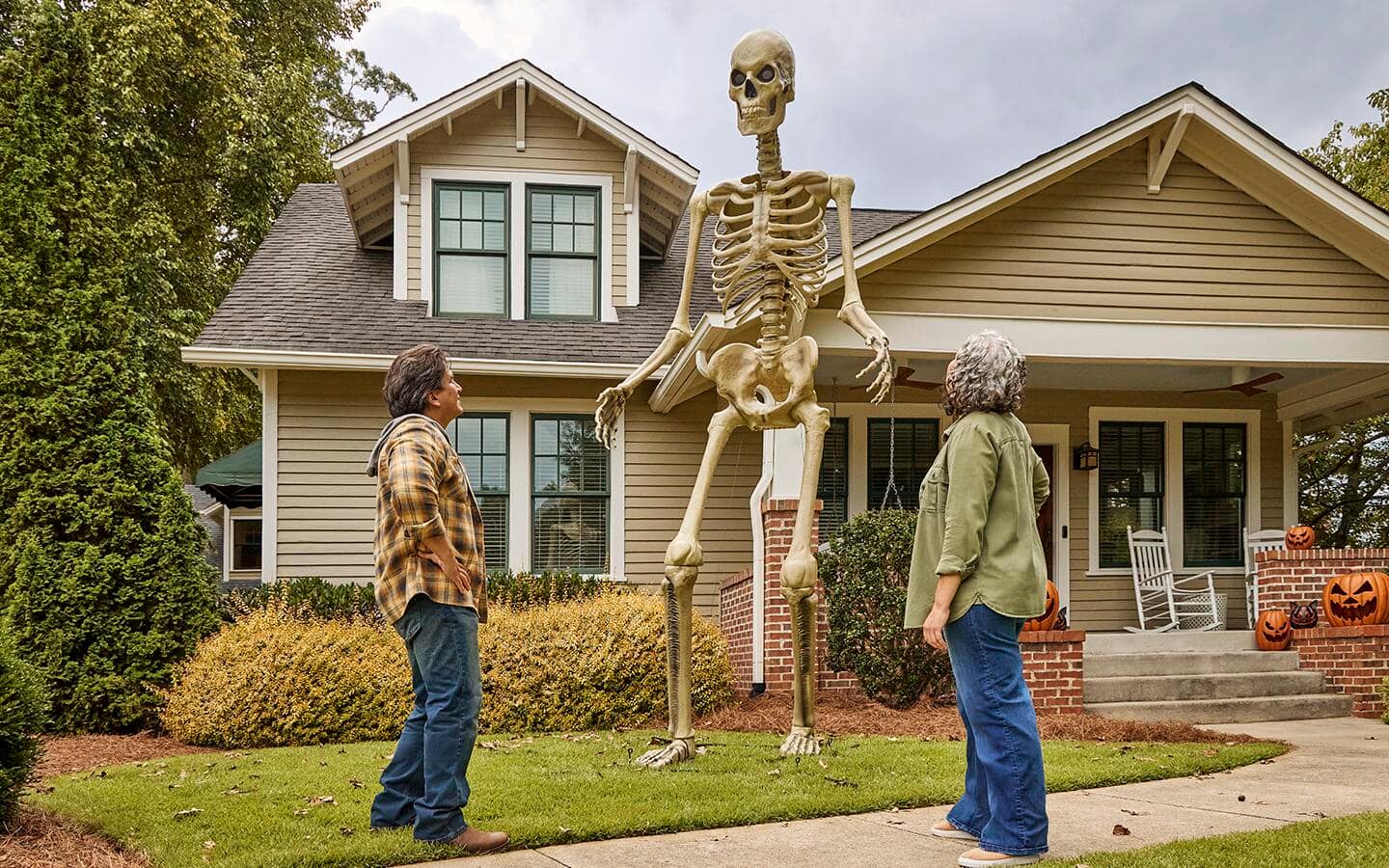Two people look at the completed skeleton after standing it upright. Two people look at the completed skeleton after standing it upright.
