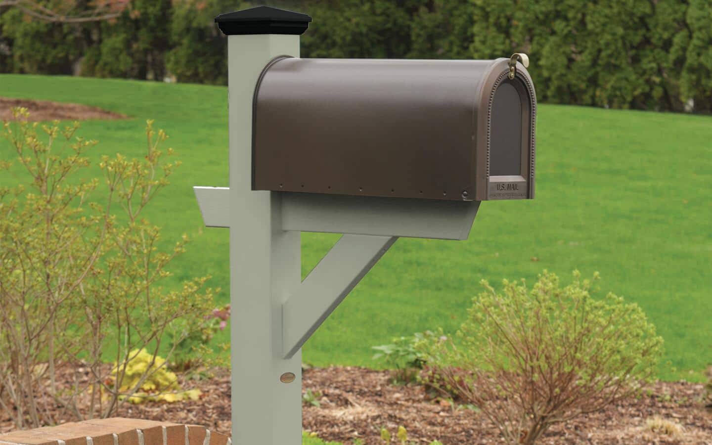 A curbside mailbox featuring a brown color. A curbside mailbox featuring a brown color.