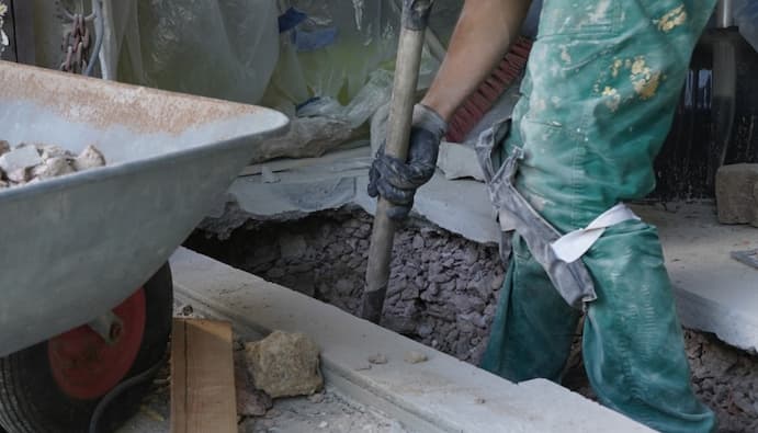 A Pro mixes concrete.