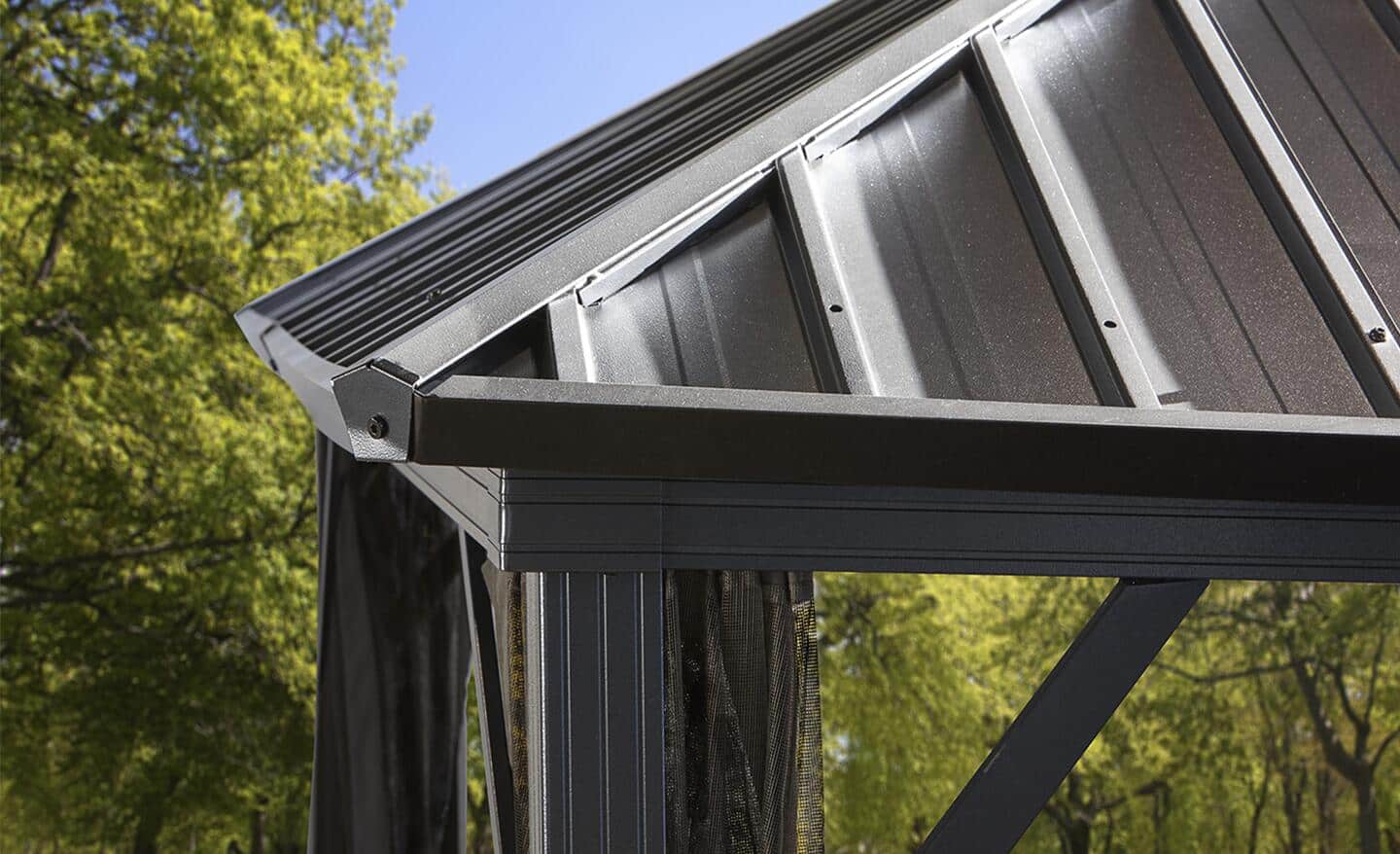 An aluminum roof installed on a building in the woods.