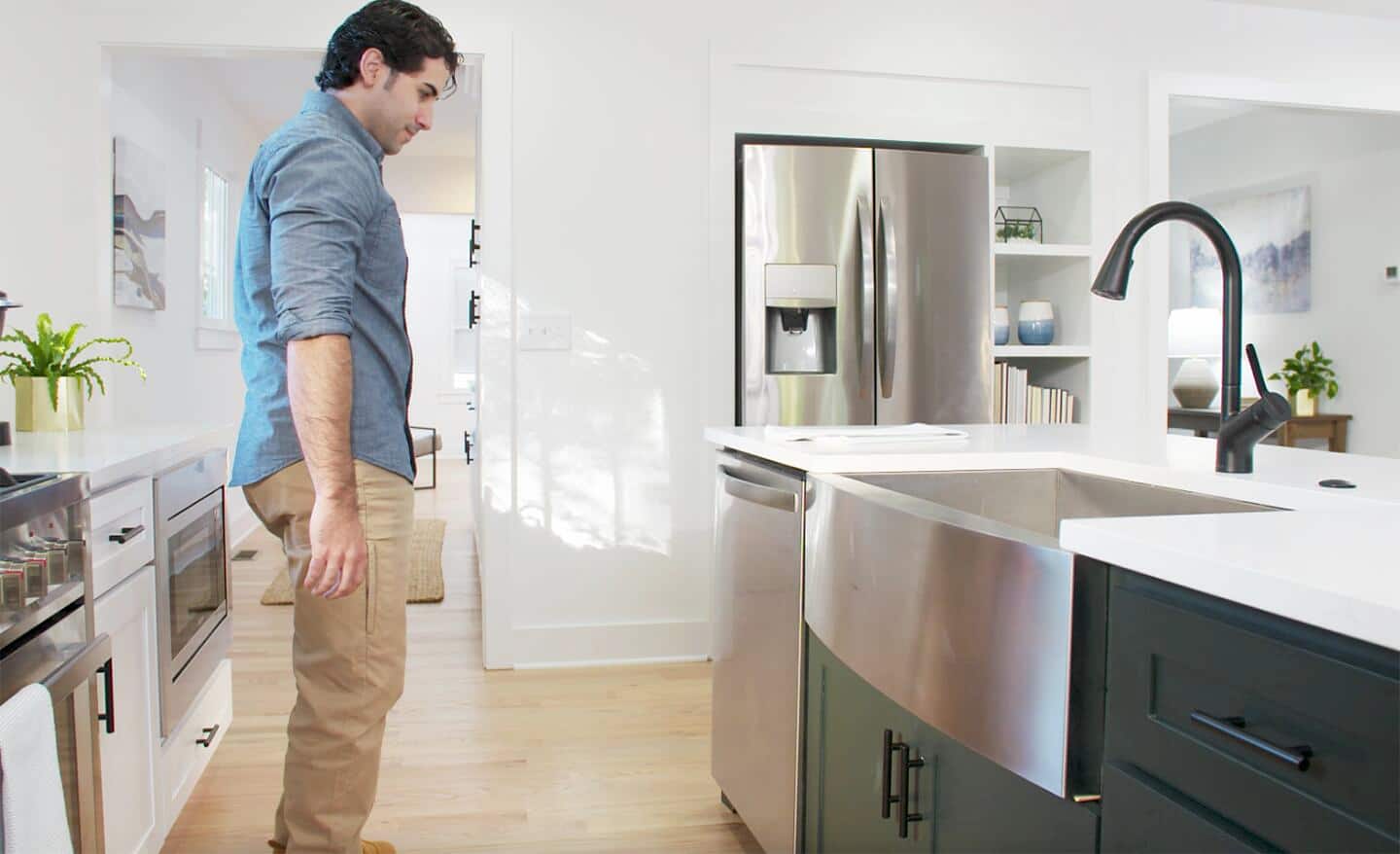 Person installs dishwasher in kitchen