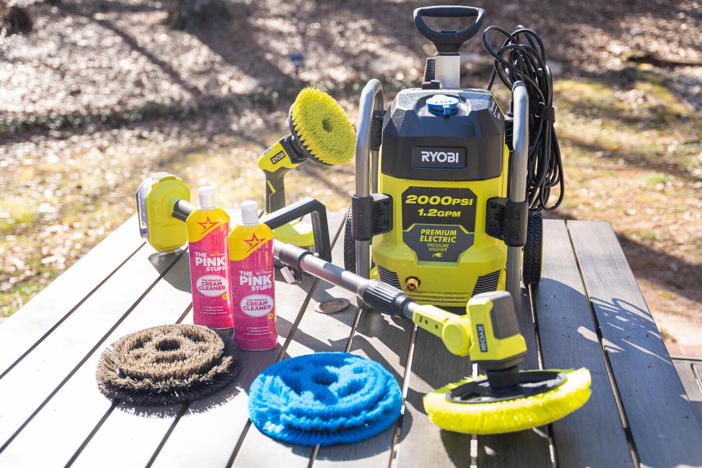 All of the tools and products Tyson used for his cleaning transformation rest on a picnic table on his patio. 