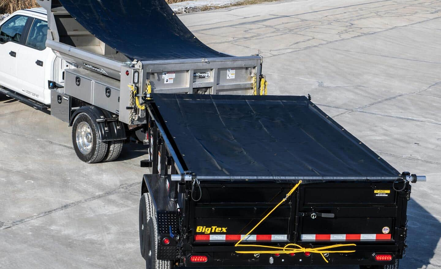 A mesh tarp covers a truck bed.