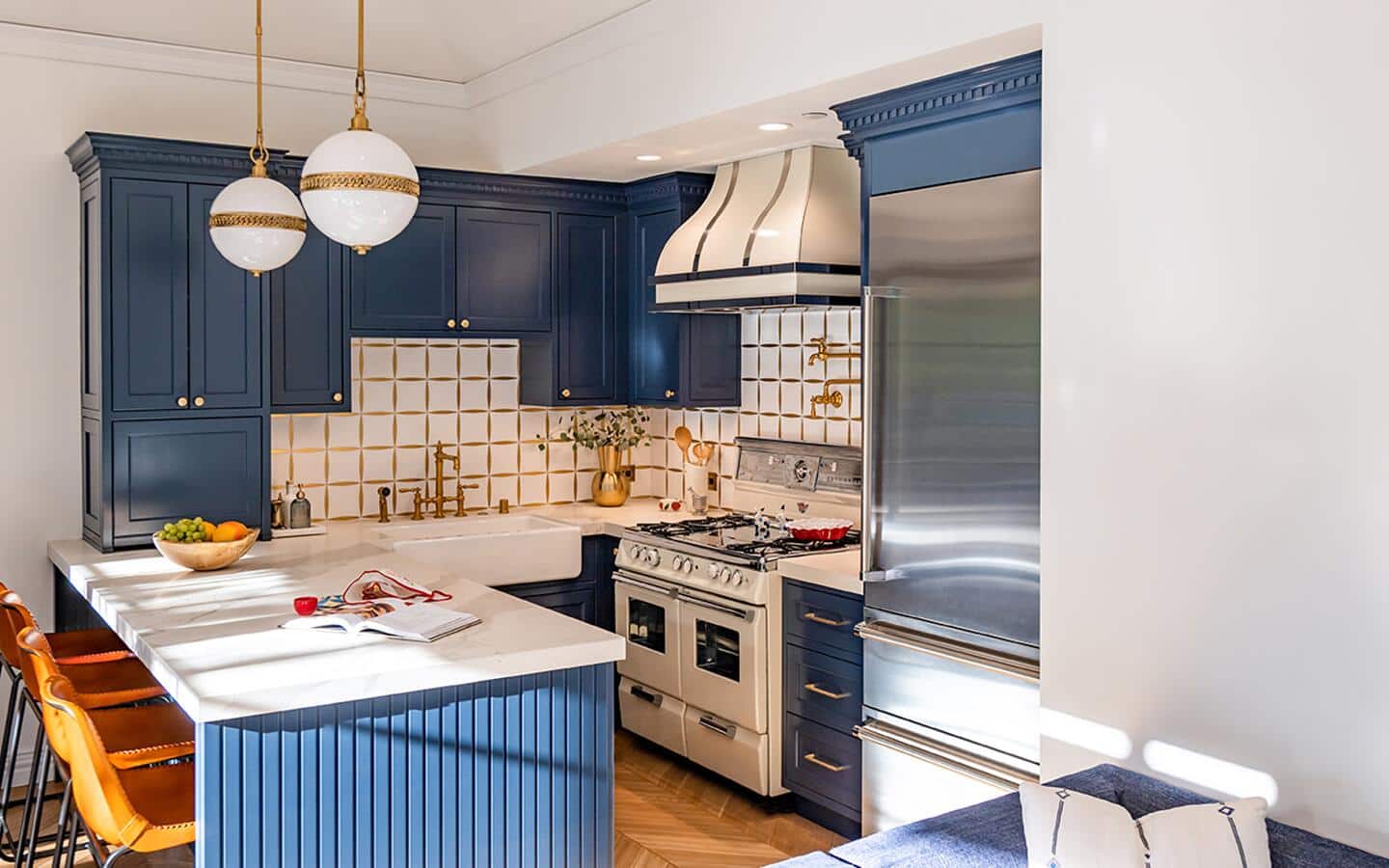 A kitchen with a white backsplash installed above the sink and stove.