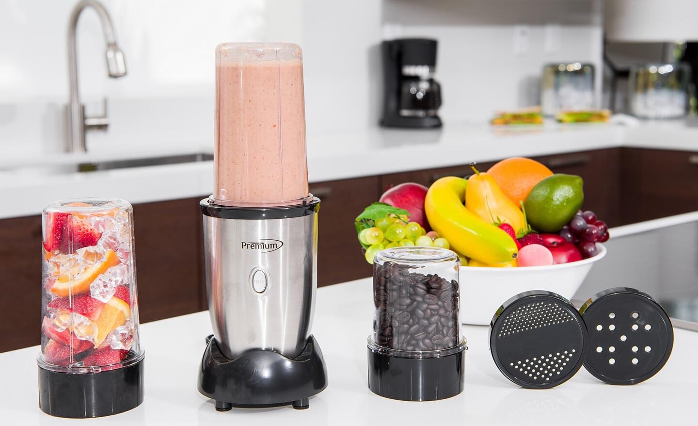 A blender with accessories on a kitchen counter