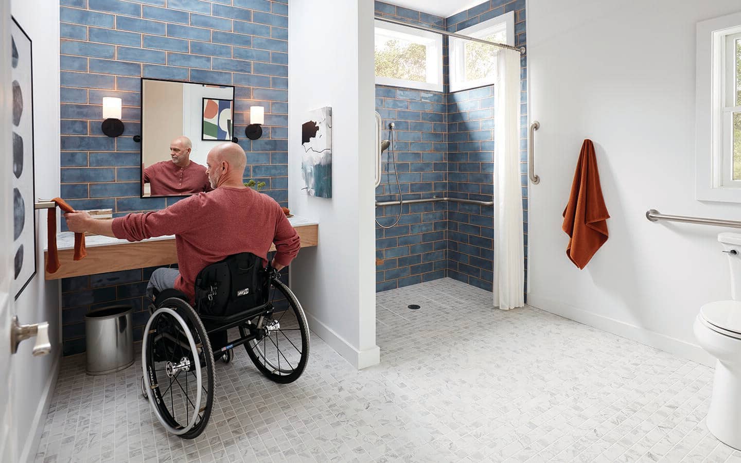 A man lifting a towel from a towel bar. A man lifting a towel from a towel bar.