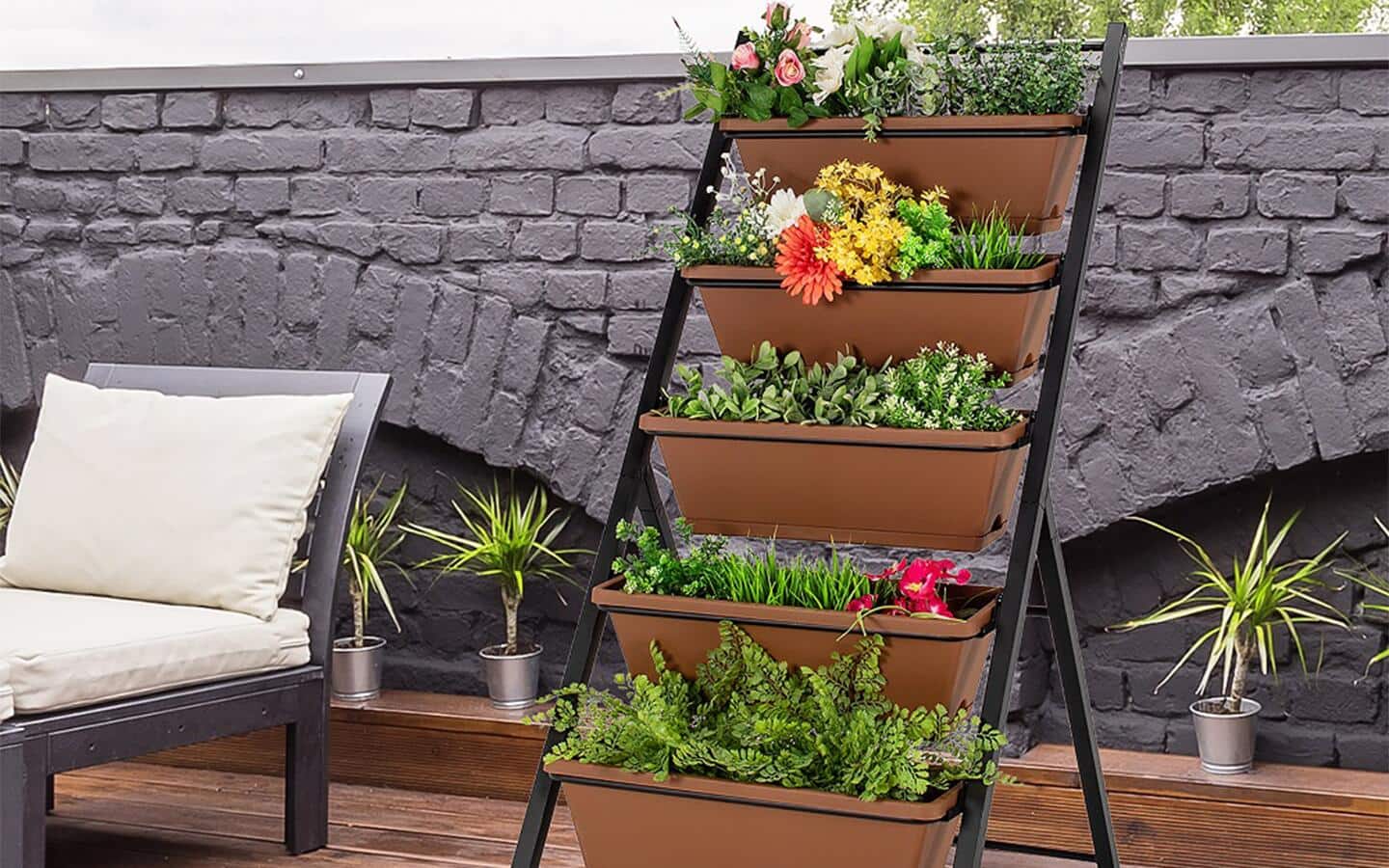 Various types of plants in containers that go up vertically.