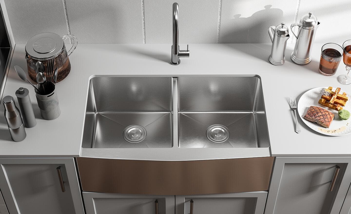 An apron-front, stainless-steel, double-basin kitchen sink.