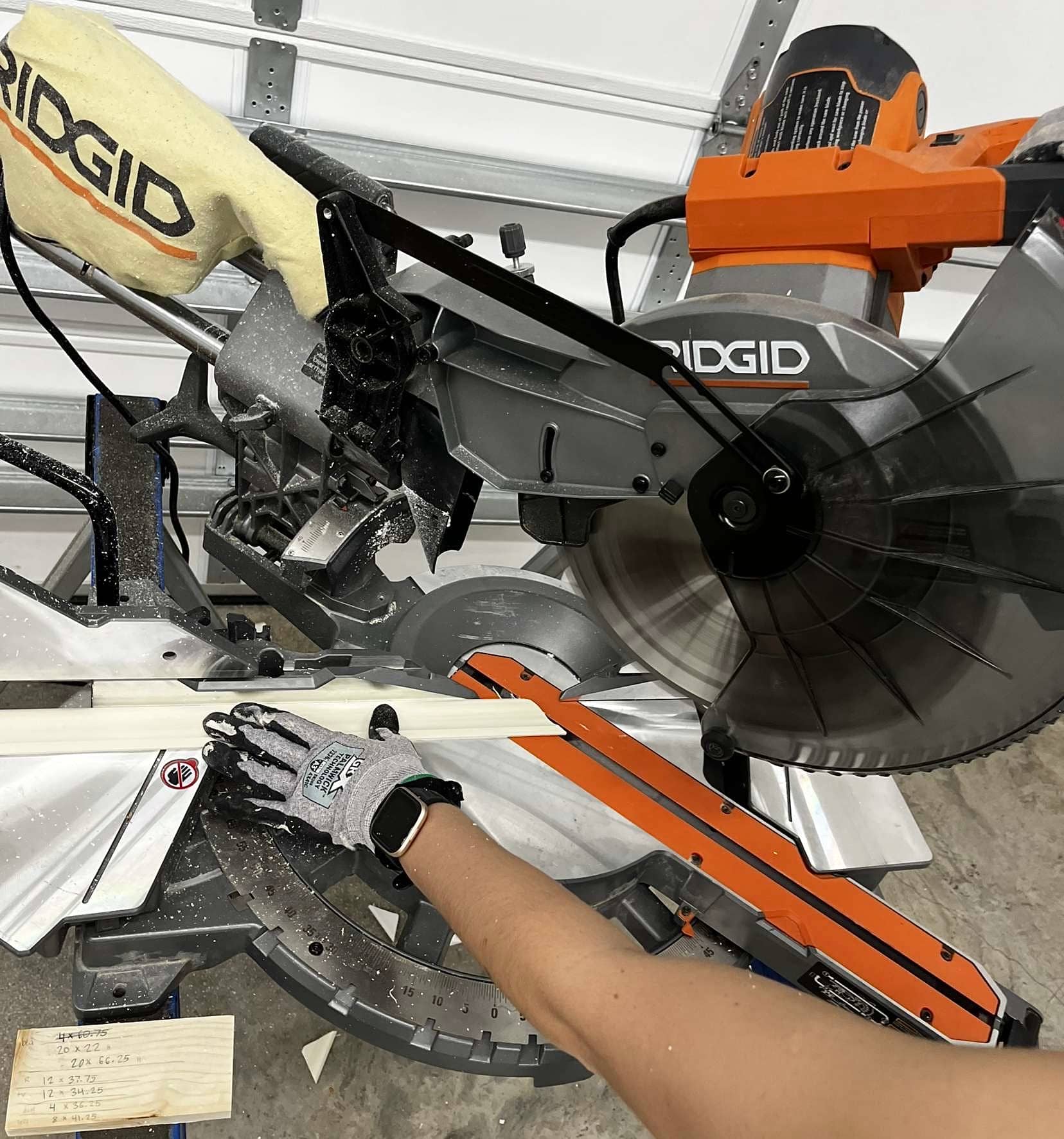 A person sawing trim pieces to size