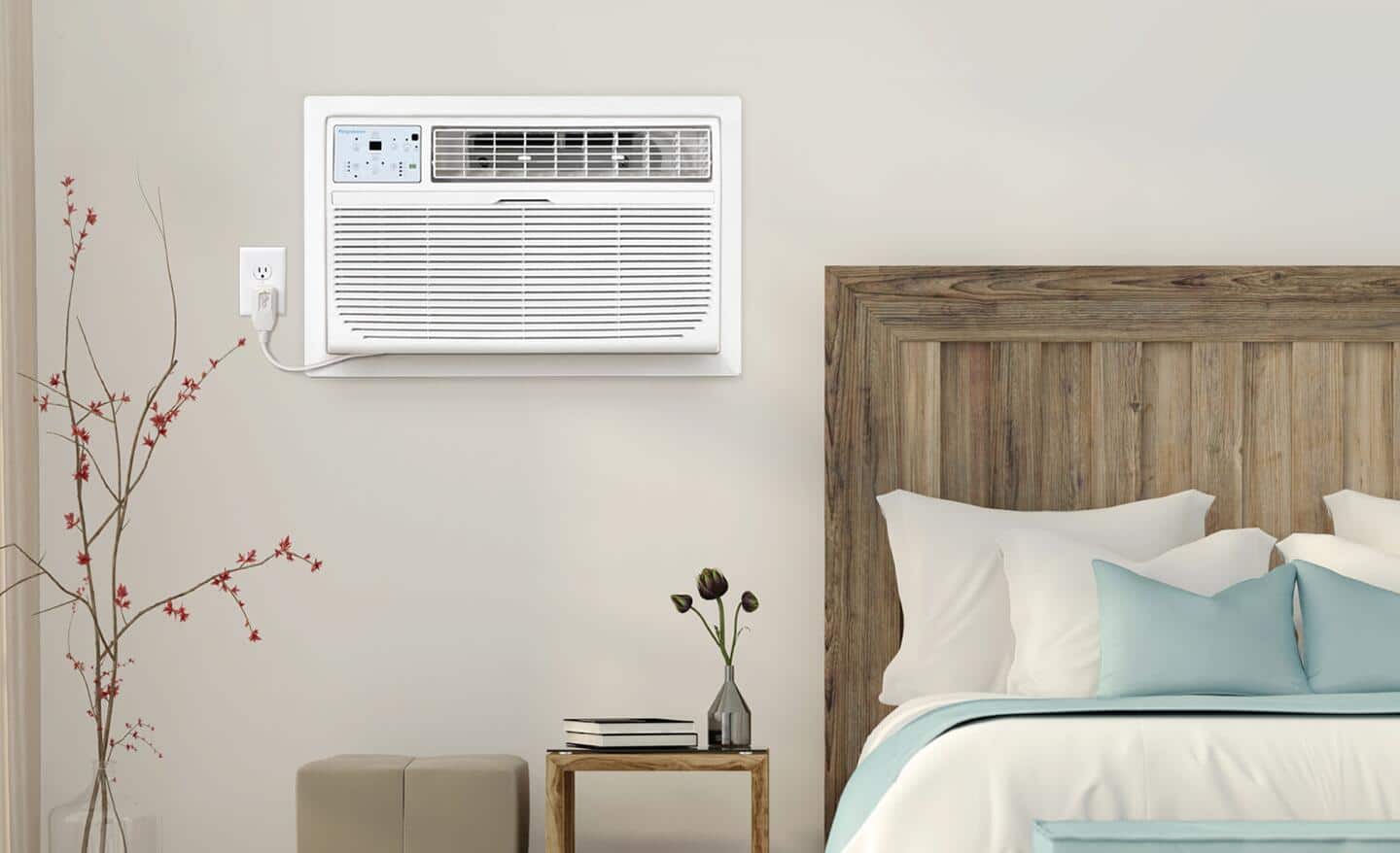 A bedroom wall featuring a white wall mounted air conditioner.