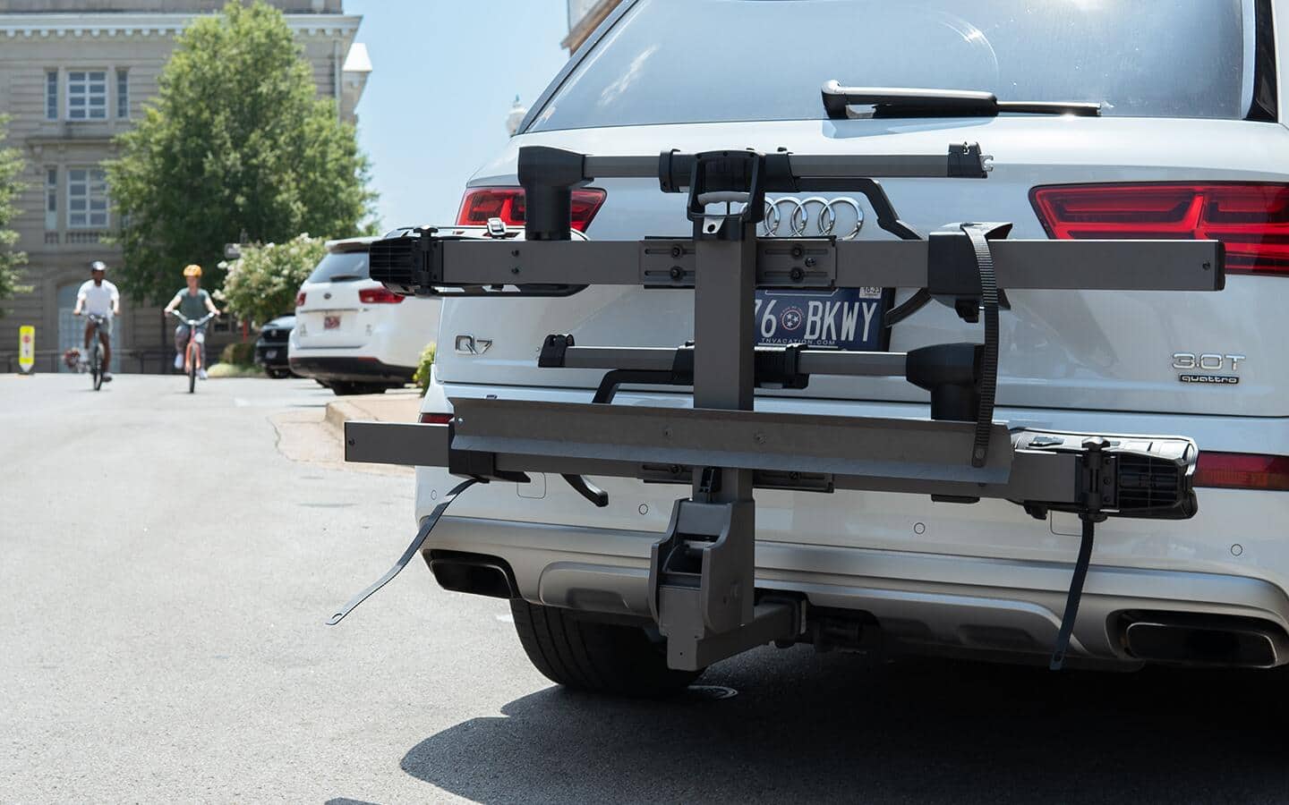 Part of a bike rack on a white car.