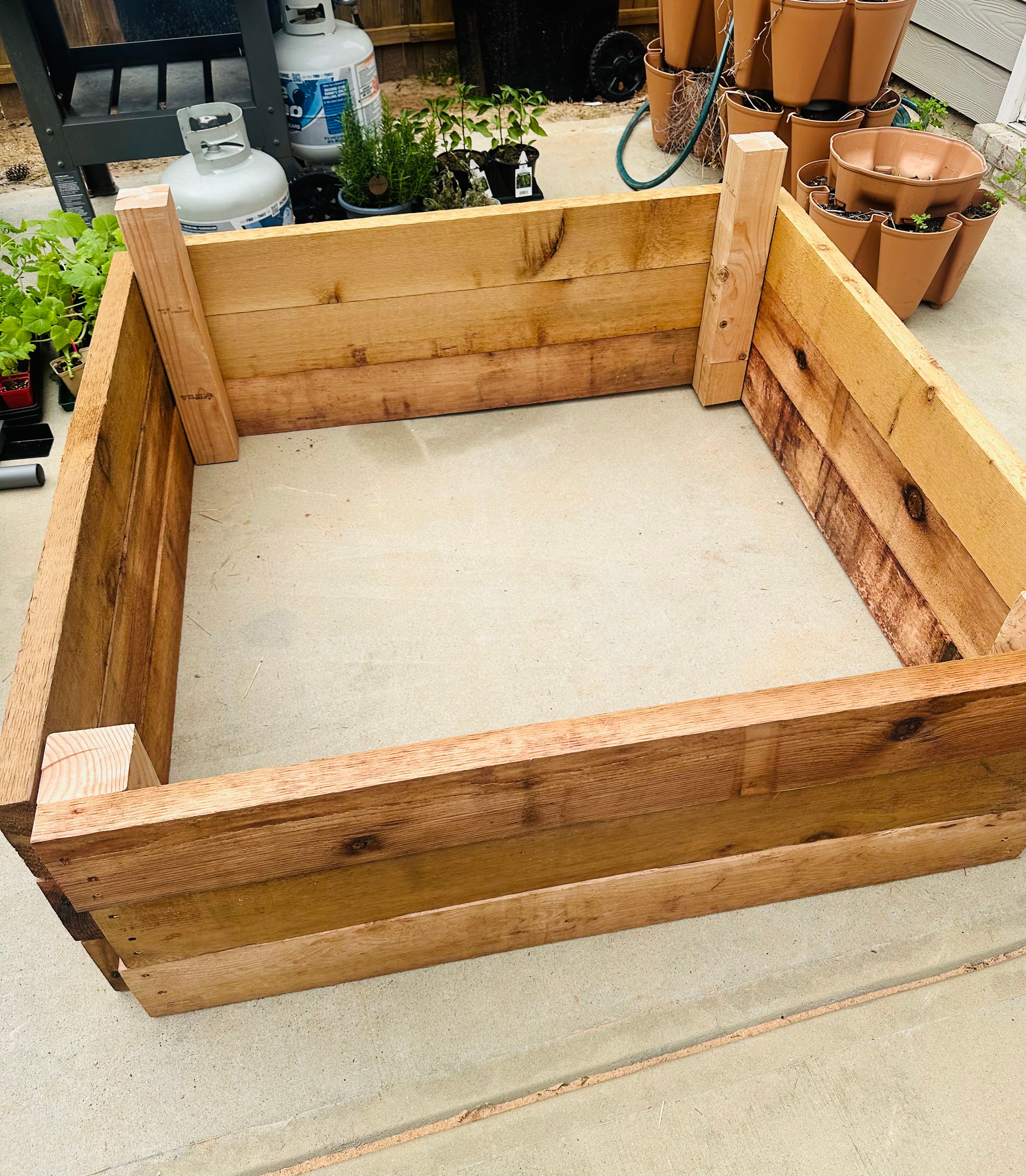 An in-progress look at a raised garden bed before its permanent placement. An in-progress look at a raised garden bed before its permanent placement.