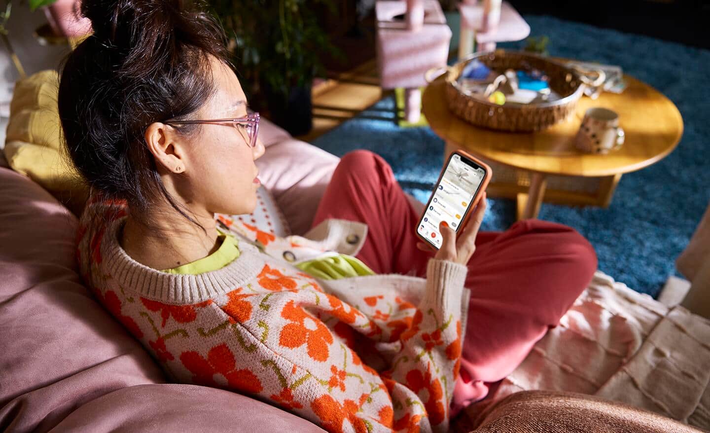 A person using the Hubspace app on a smart device. A person using the Hubspace app on a smart device.