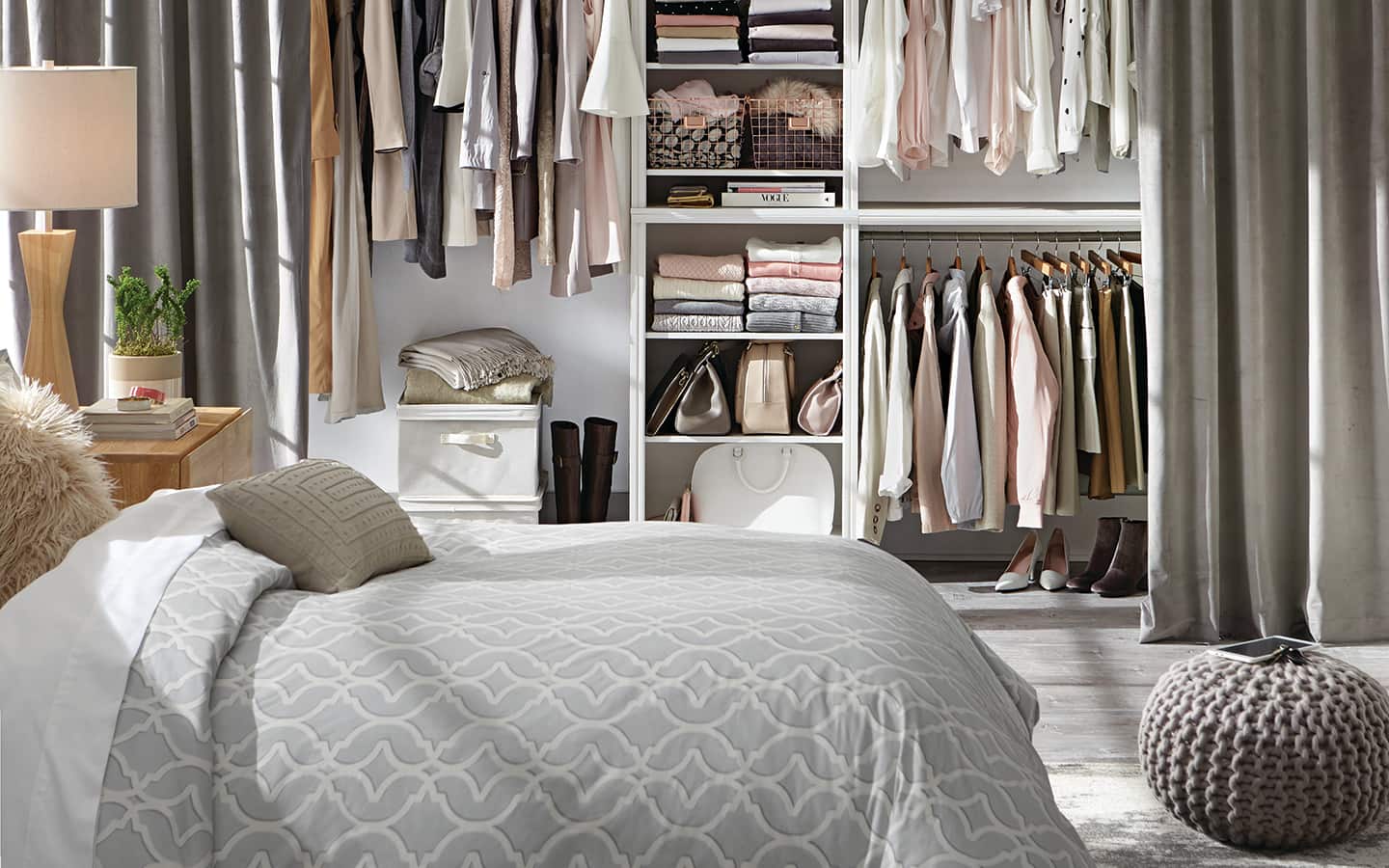 Bedroom with an open closet made out of curtains