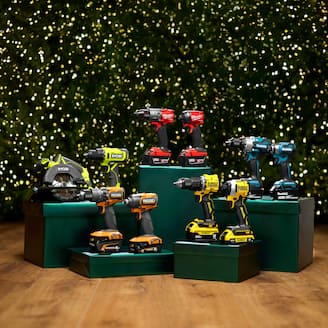 Multiple different brands power drills displayed on small boxes