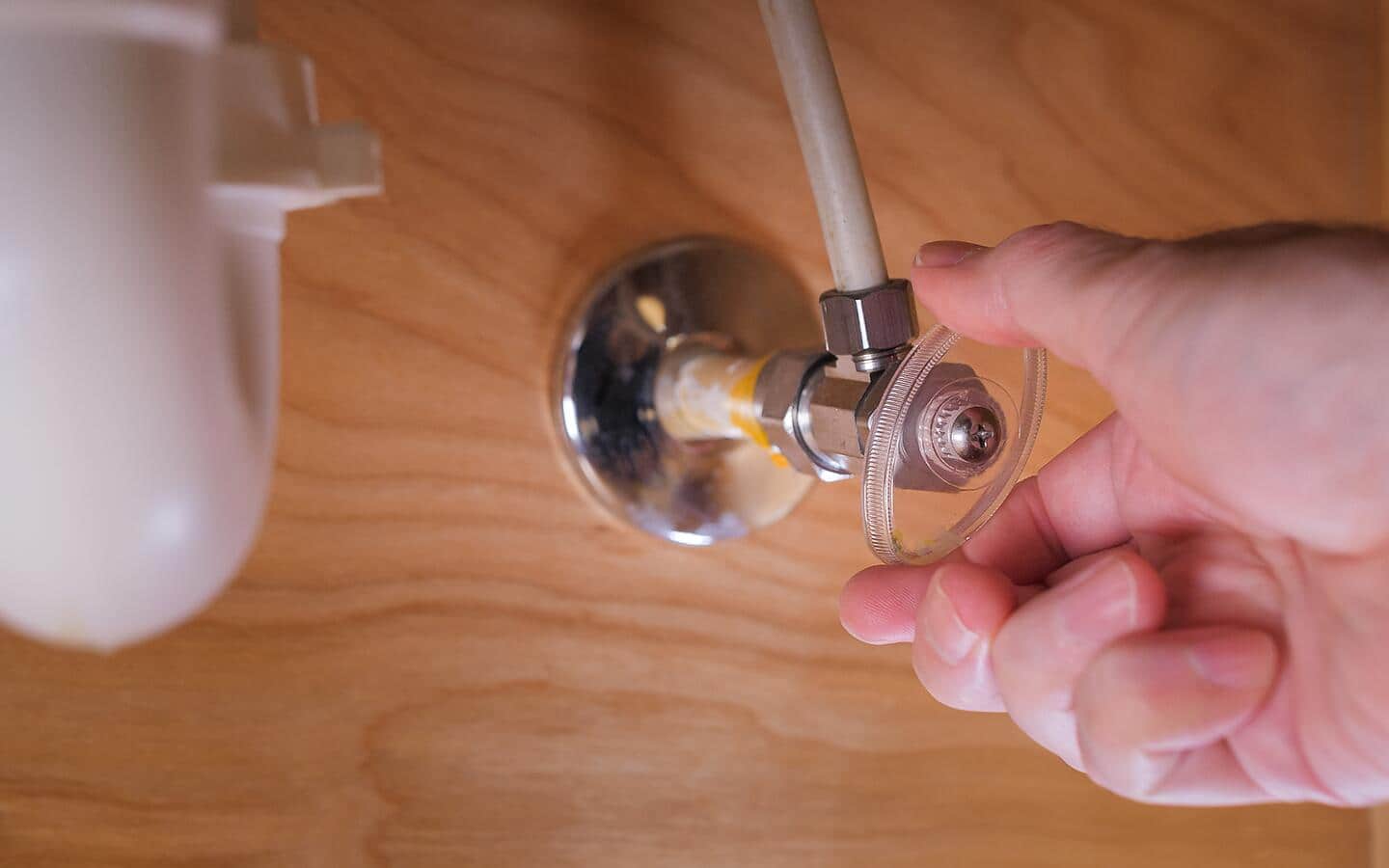 Person turning off the water. Person turning off the water.