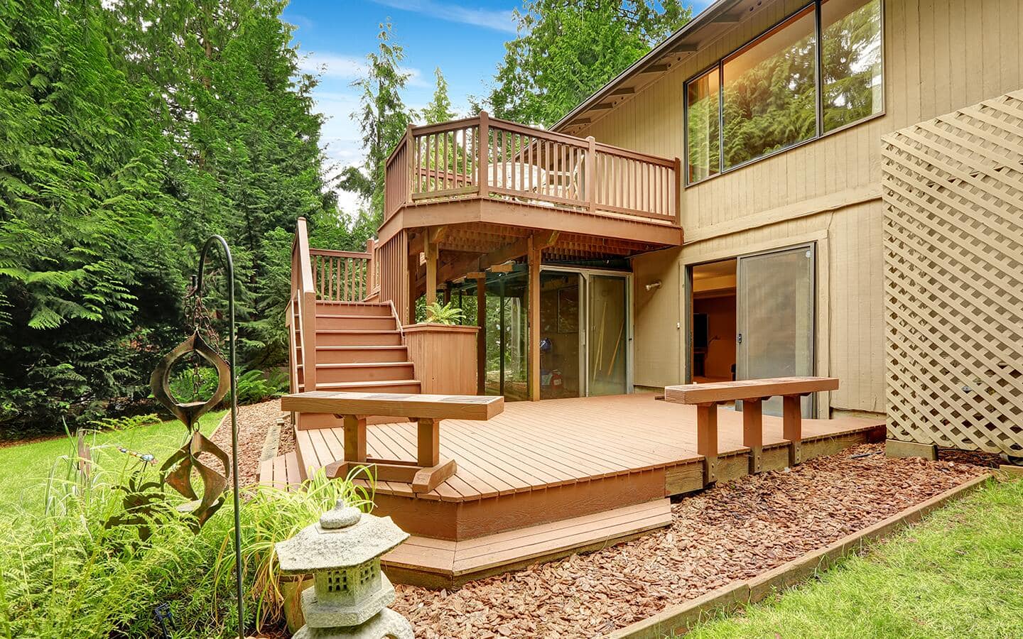 A multilevel deck includes matching bench seating and a staircase leading to the upper level. A multilevel deck includes matching bench seating and a staircase leading to the upper level.