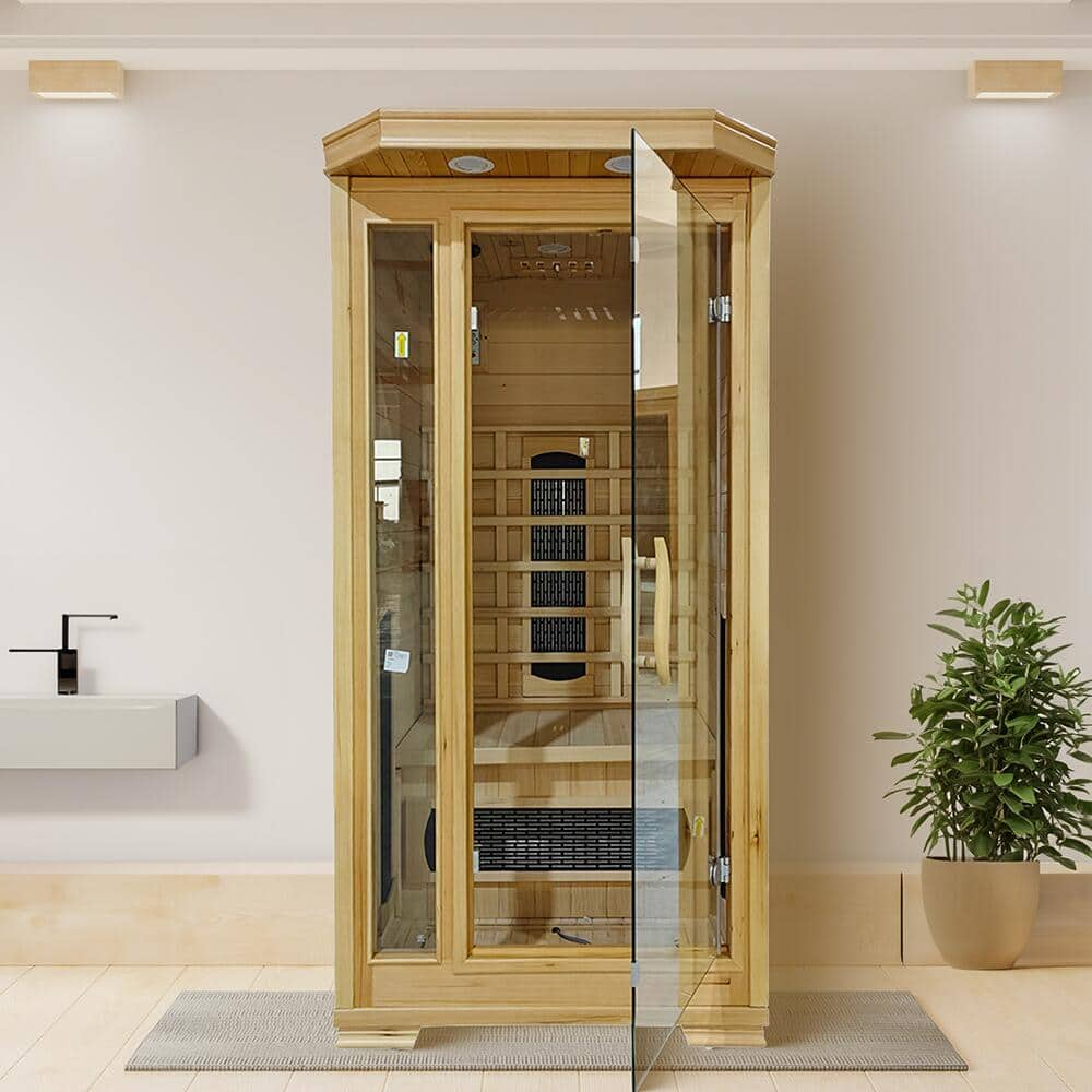 A single-person sauna with glass doors.