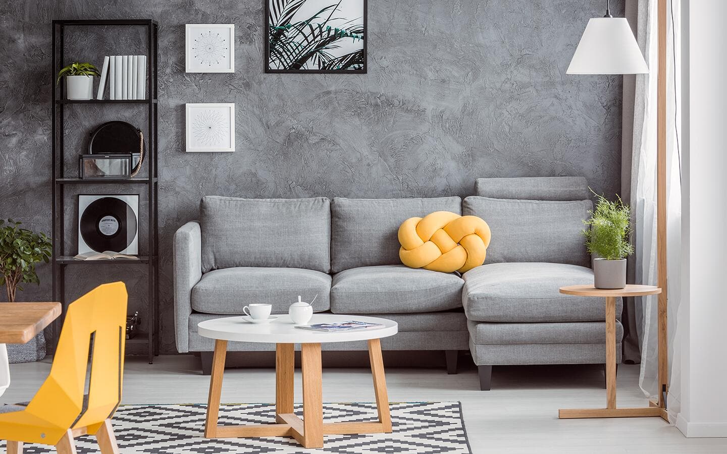 A gray living room with yellow accents.