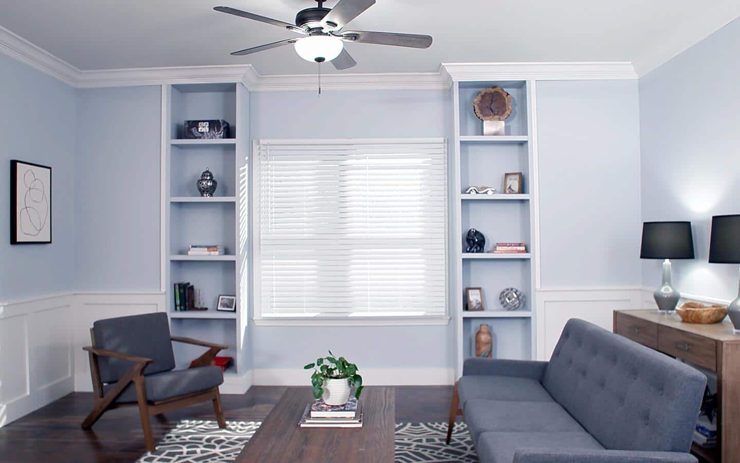 Two completed DIY bookshelves built around a living room window. Two completed DIY bookshelves built around a living room window.