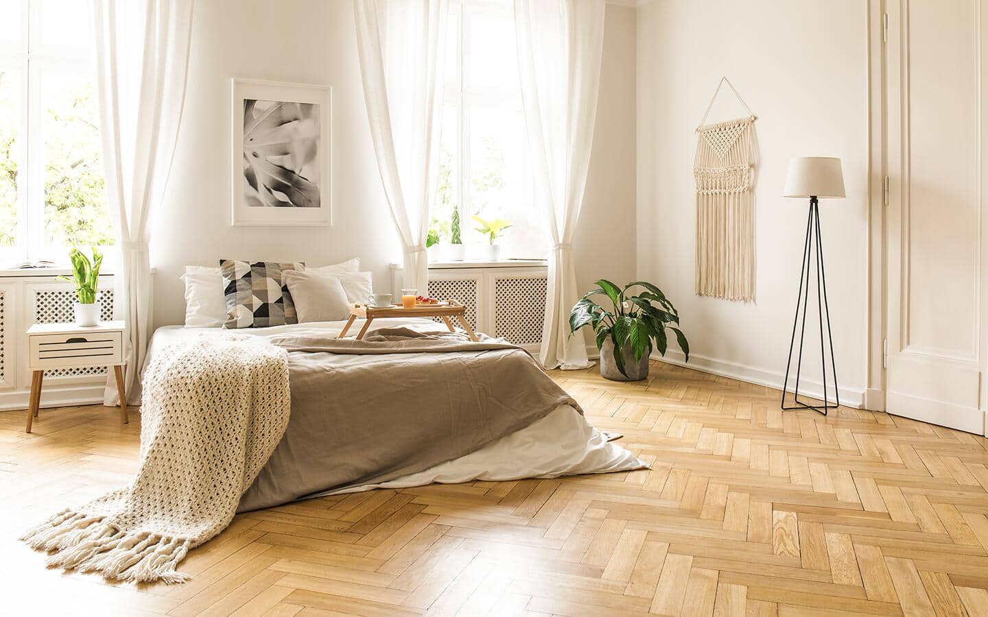 A parquet tile floor decorates a bedroom. A parquet tile floor decorates a bedroom.