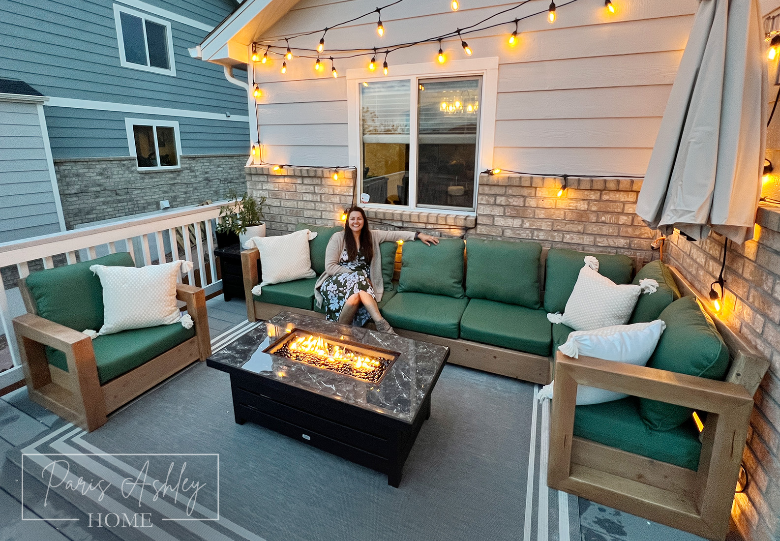 A woman enjoying her refreshed and decorated patio A woman enjoying her refreshed and decorated patio