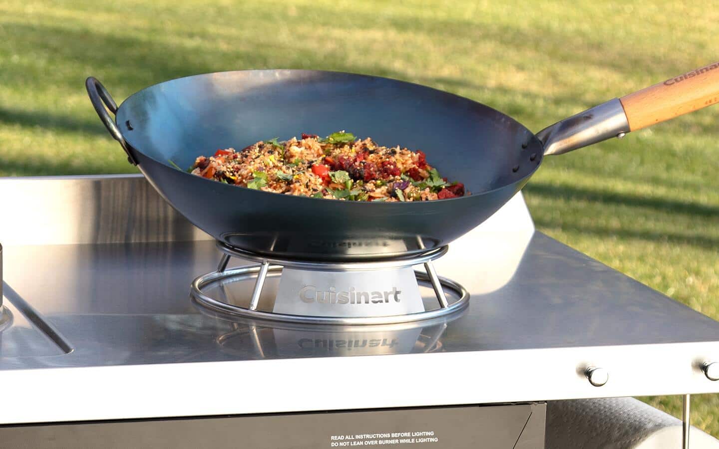 Food cooking in a wok on a stabilizing wok ring. Food cooking in a wok on a stabilizing wok ring.