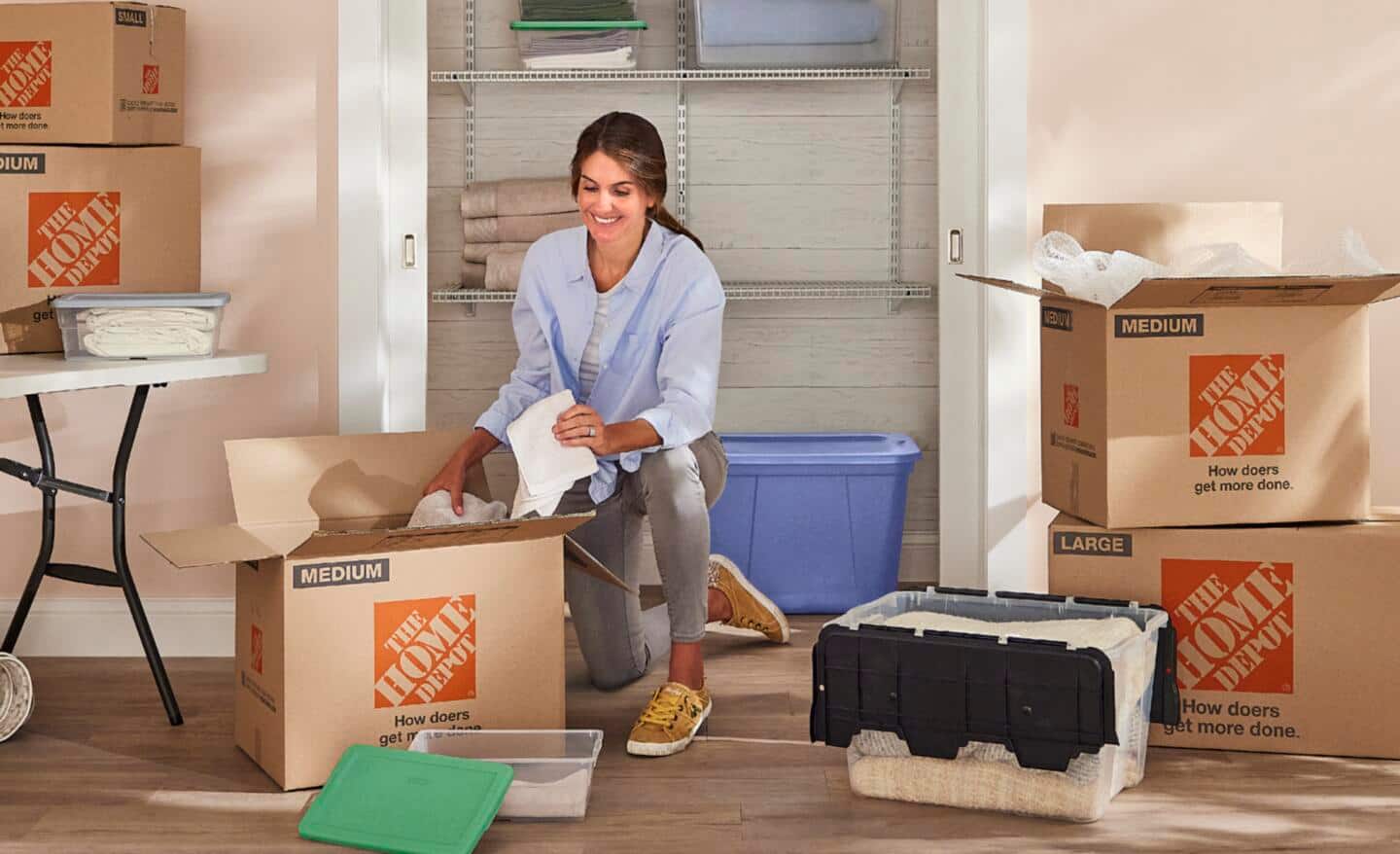 Woman packing moving boxes.
