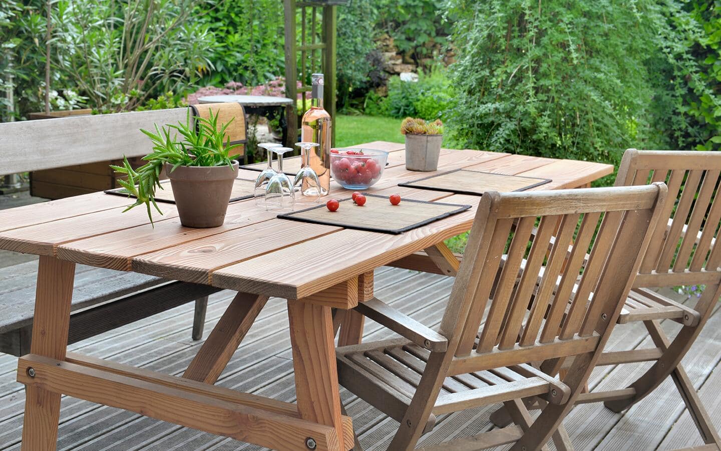 An outdoor picnic table and chair.