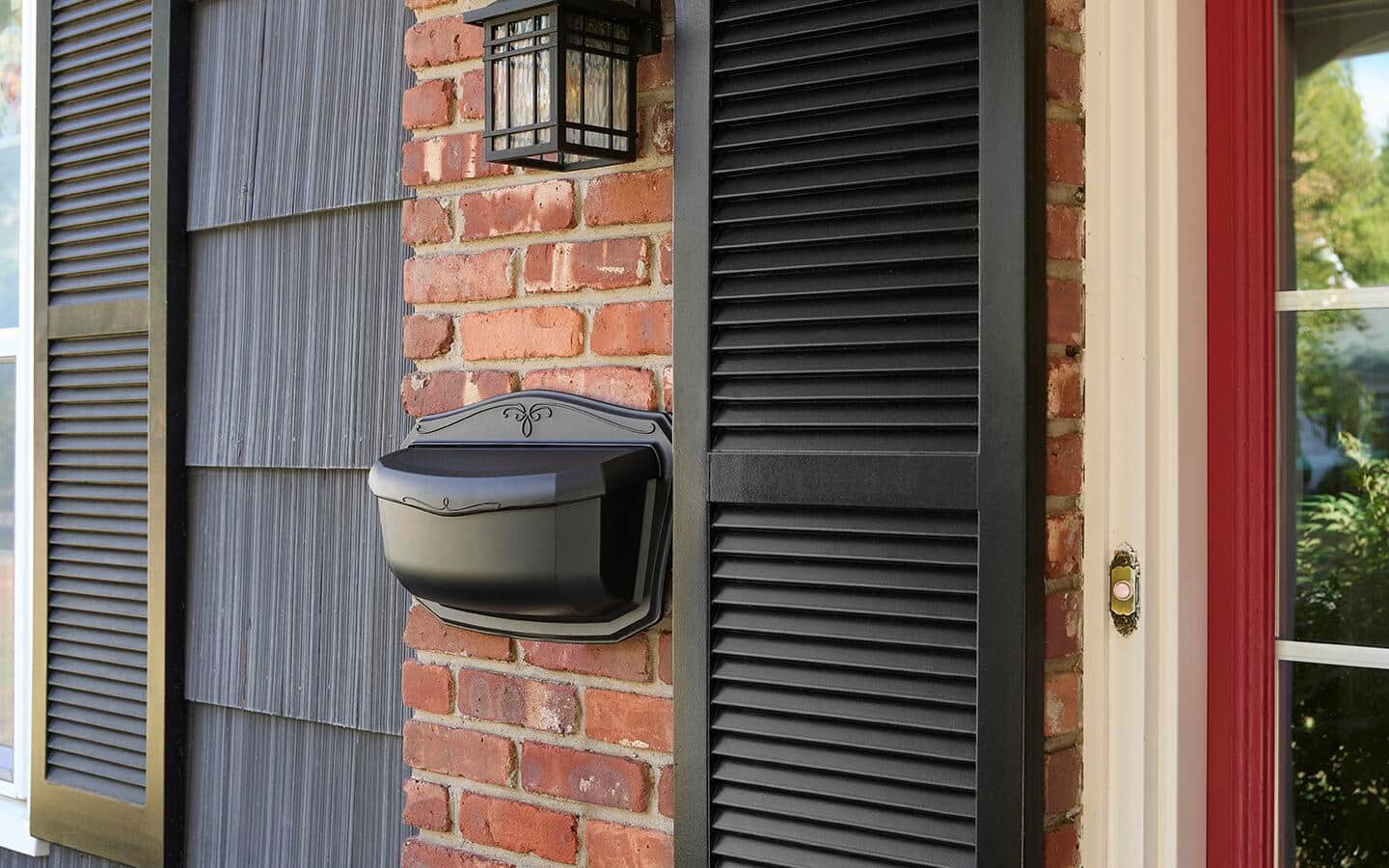 A mailbox slot installed in the exterior brick wall of a house. A mailbox slot installed in the exterior brick wall of a house.