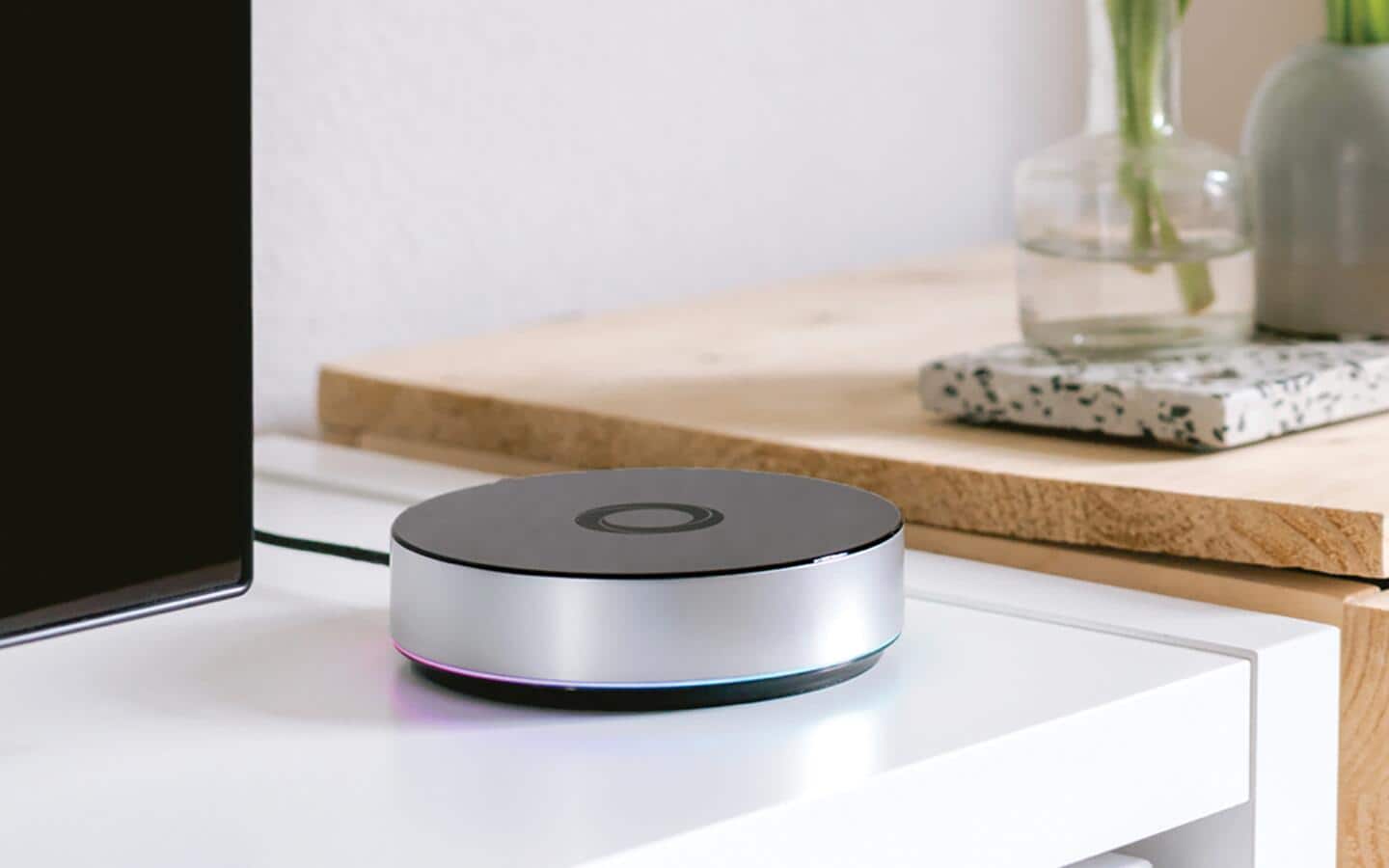 A smart home hub on a shelf.
