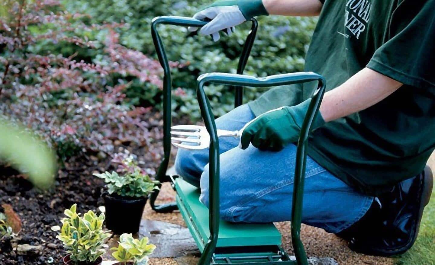 Person uses a garden kneeler to cushion their knees while pulling weeds