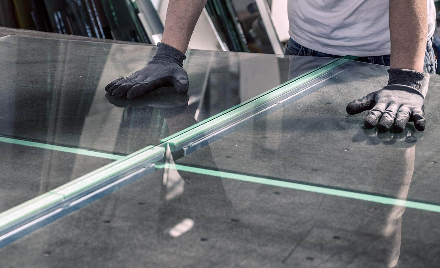 Glass being snapped on a work table.