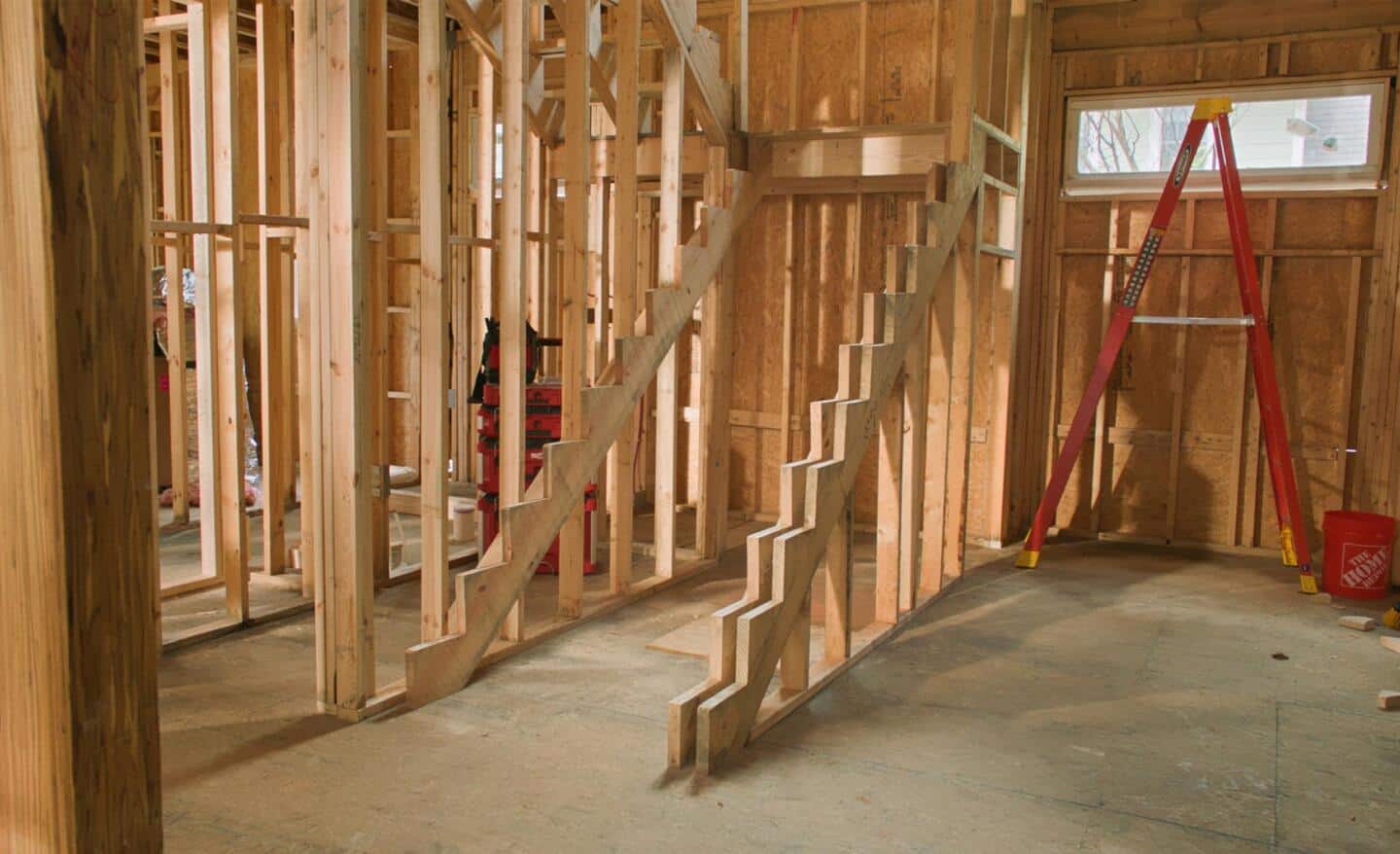Stair stringers are installed during the framing of a house.