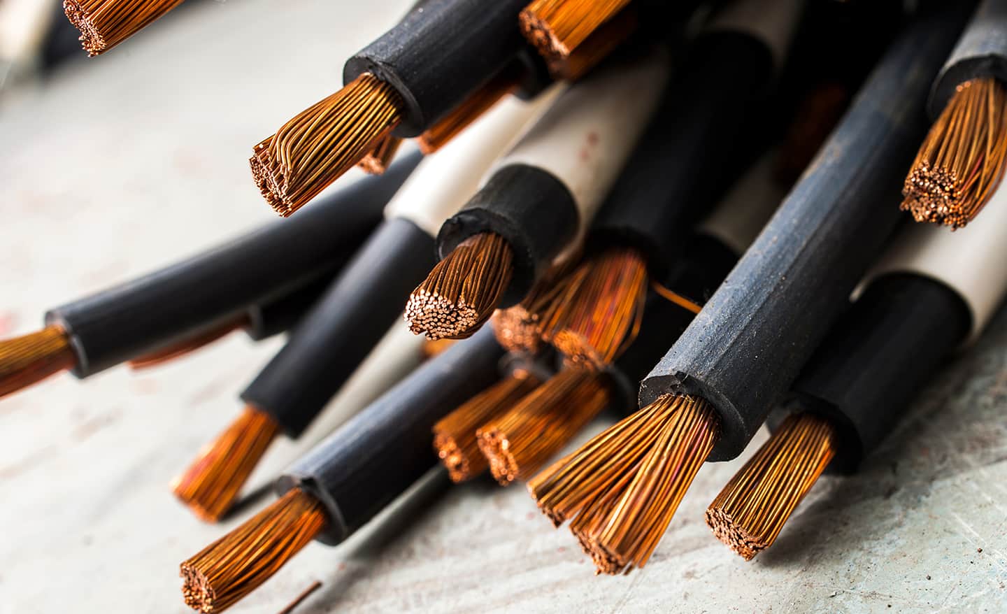 Up close view of cable that has been cut to expose the interior wires and layers of sheathing. 