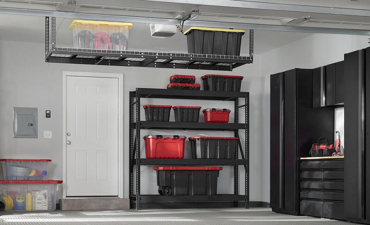 An overhead storage rack holds containers in a garage. 