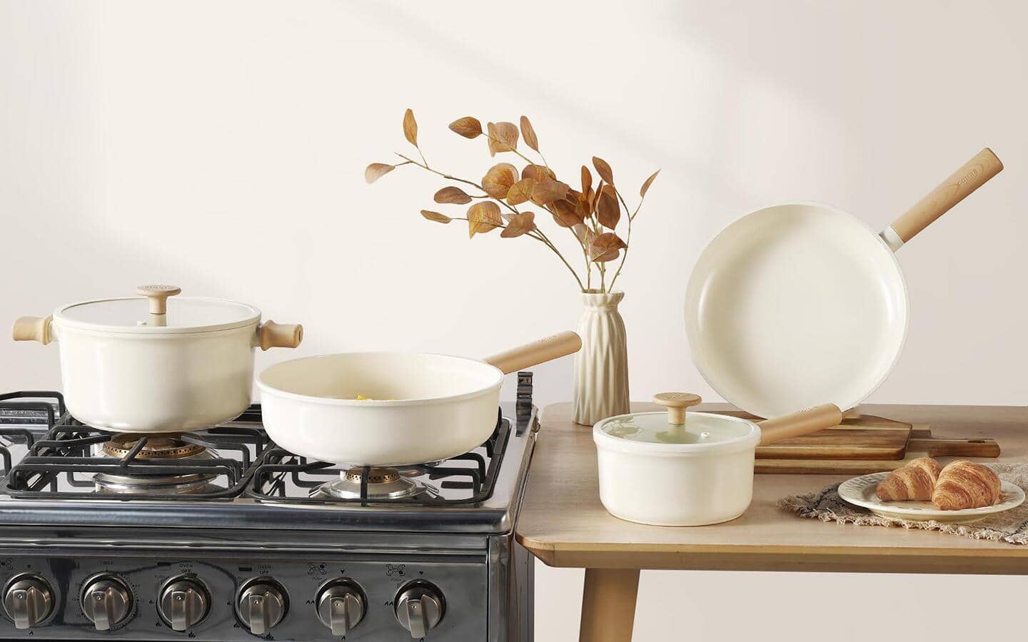 White, non-stick cookware being used in a kitchen.