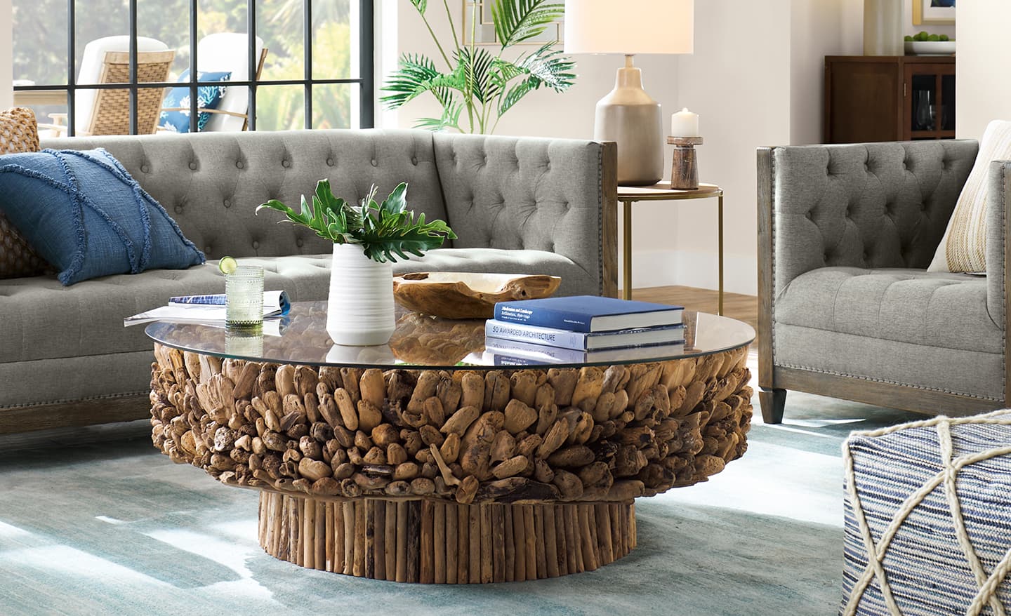 Coffee table with a vase and objects in a living room